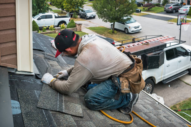 Professional Roof Repair technician working in Cogan Station, PA